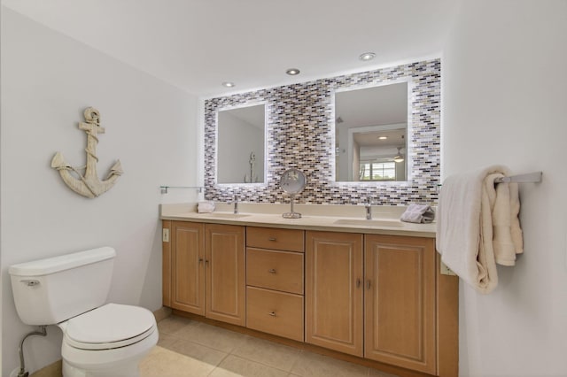 22 Royal Palm Way Unit 205, Boca Raton, FL 33432 - bathroom with double vanity, tile patterned flooring, recessed lighting, and decorative backsplash