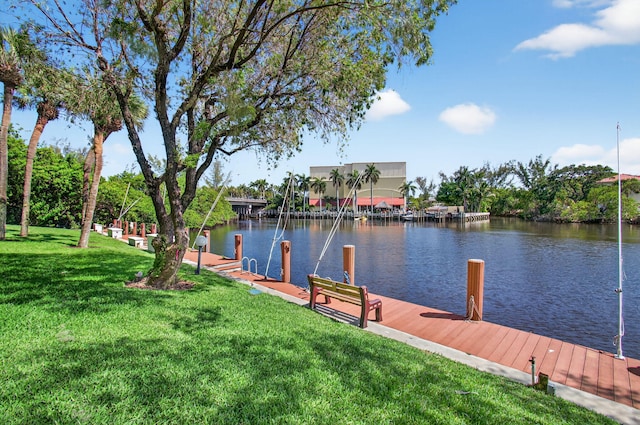 22 Royal Palm Way Unit 205, Boca Raton, FL 33432 - dock area with a water view and a lawn