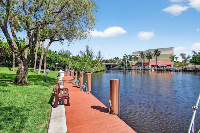22 Royal Palm Way Unit 205, Boca Raton, FL 33432 - dock featuring a water view and a lawn