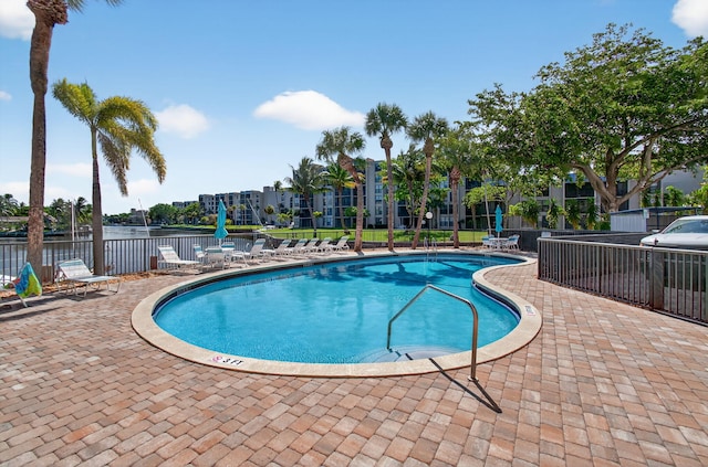 22 Royal Palm Way Unit 205, Boca Raton, FL 33432 - community pool featuring a patio and a water view