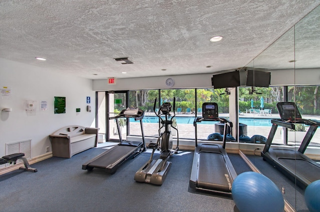 22 Royal Palm Way Unit 205, Boca Raton, FL 33432 - workout area featuring a textured ceiling and recessed lighting