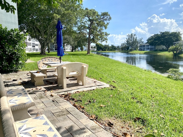 2008 Westbury F, Deerfield Beach, FL 33442 - view of grassy yard with a water view and a patio