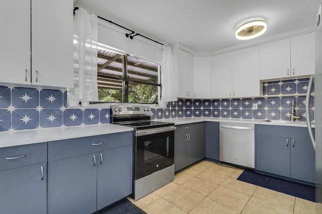 9277 Bloomfield Dr, Palm Beach Gardens, FL 33410 - kitchen featuring appliances with stainless steel finishes, light countertops, tasteful backsplash, and light tile patterned floors