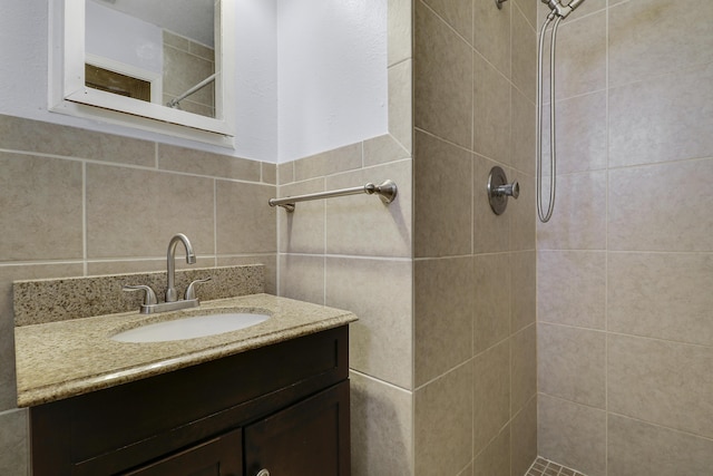 9277 Bloomfield Dr, Palm Beach Gardens, FL 33410 - full bath with a tile shower, vanity, and tile walls