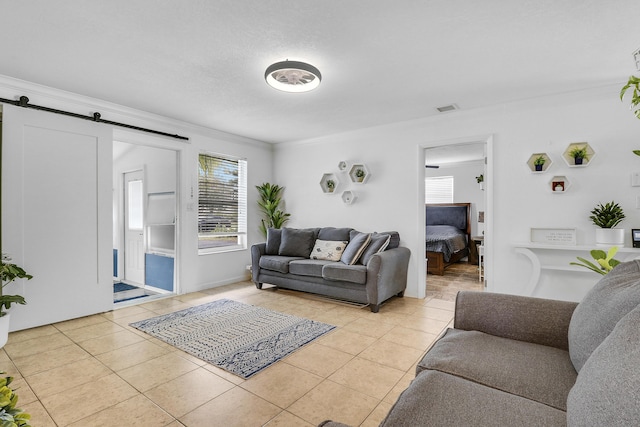9277 Bloomfield Dr, Palm Beach Gardens, FL 33410 - tiled living room with crown molding and a barn door