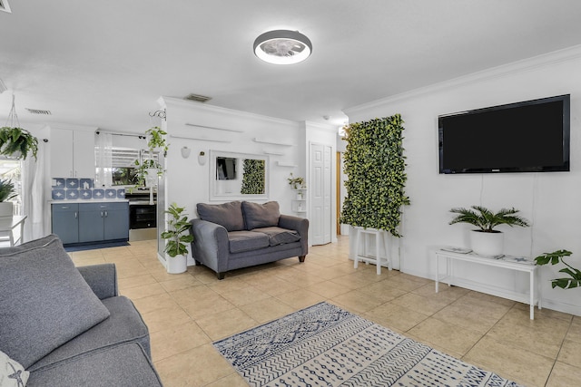 9277 Bloomfield Dr, Palm Beach Gardens, FL 33410 - living room featuring light tile patterned flooring and ornamental molding