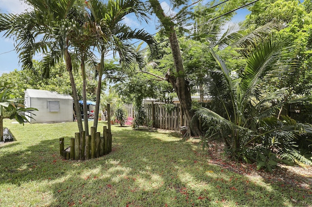 9277 Bloomfield Dr, Palm Beach Gardens, FL 33410 - view of yard featuring an outbuilding