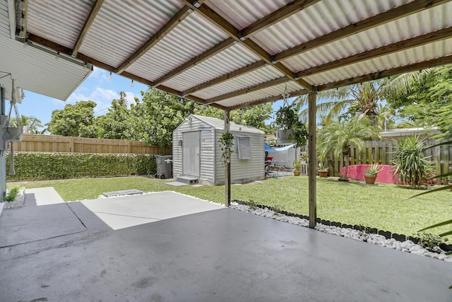9277 Bloomfield Dr, Palm Beach Gardens, FL 33410 - fenced backyard featuring a shed and a patio