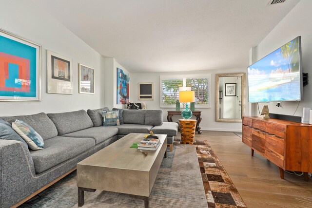 5551 SE Nassau Ter, Stuart, FL 34997 - living area featuring wood finished floors and baseboards