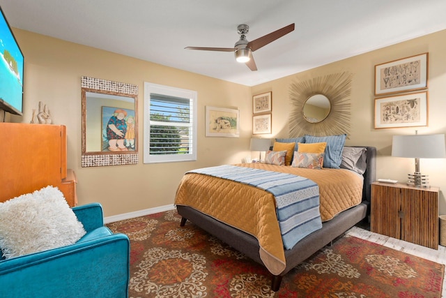 5551 SE Nassau Ter, Stuart, FL 34997 - bedroom featuring baseboards and a ceiling fan