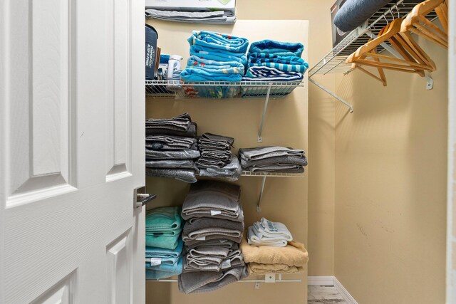 5551 SE Nassau Ter, Stuart, FL 34997 - walk in closet featuring marble look tiles