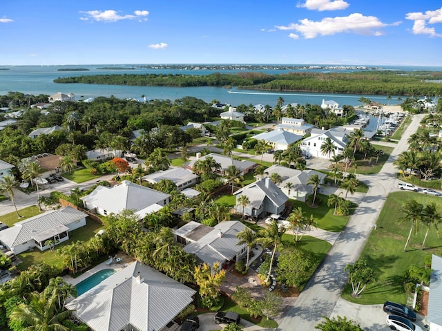 5551 SE Nassau Ter, Stuart, FL 34997 - aerial view of residential area featuring a nearby body of water and a pool area