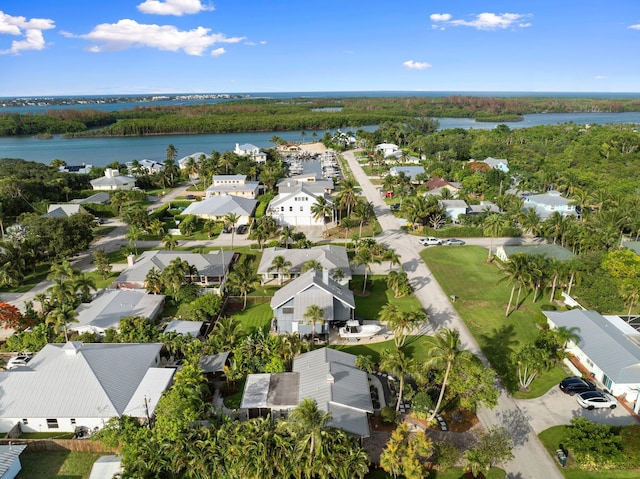 5551 SE Nassau Ter, Stuart, FL 34997 - aerial view of property and surrounding area featuring a nearby body of water and nearby suburban area