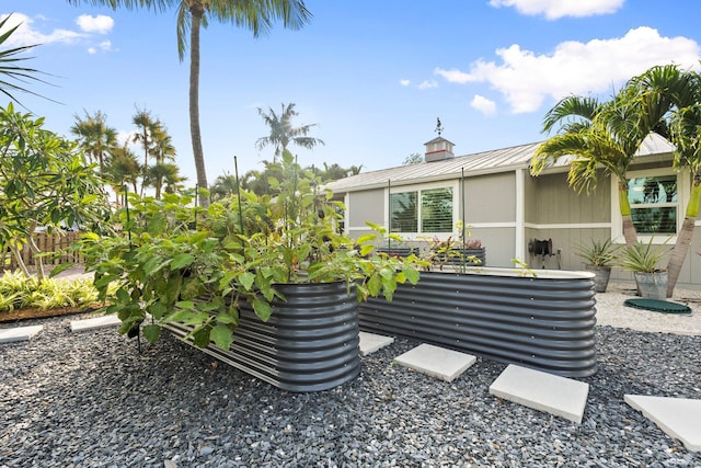 5551 SE Nassau Ter, Stuart, FL 34997 - view of property exterior with metal roof and a standing seam roof