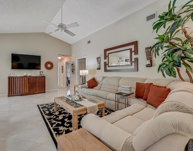 1500 Chapparel Way, Wellington, FL 33414 - living area with vaulted ceiling, ceiling fan, a textured ceiling, and light tile patterned floors