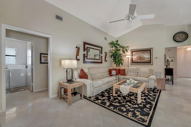 1500 Chapparel Way, Wellington, FL 33414 - living room featuring lofted ceiling, a ceiling fan, washer and dryer, and light tile patterned floors