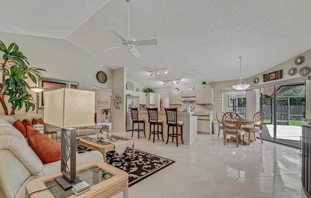 1500 Chapparel Way, Wellington, FL 33414 - living room with a textured ceiling, lofted ceiling, and a ceiling fan
