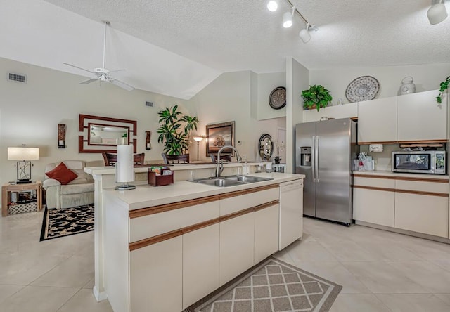 1500 Chapparel Way, Wellington, FL 33414 - kitchen with appliances with stainless steel finishes, open floor plan, ceiling fan, light countertops, and lofted ceiling