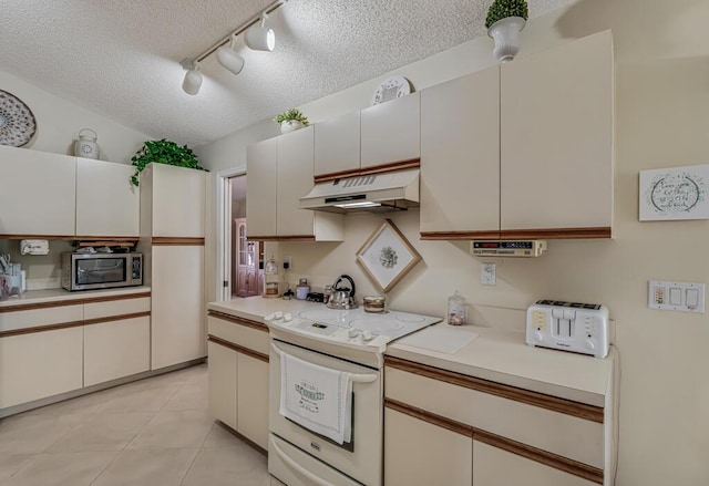 1500 Chapparel Way, Wellington, FL 33414 - kitchen with white electric stove, under cabinet range hood, stainless steel microwave, track lighting, and a textured ceiling