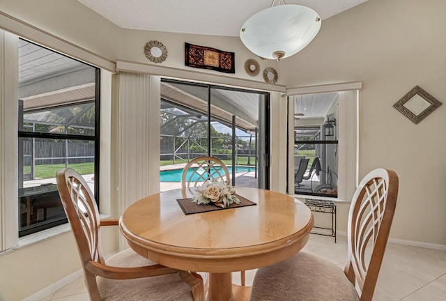 1500 Chapparel Way, Wellington, FL 33414 - dining space with a sunroom, light tile patterned flooring, and plenty of natural light