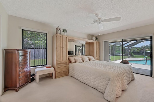 1500 Chapparel Way, Wellington, FL 33414 - bedroom featuring light colored carpet, access to exterior, a textured ceiling, and multiple windows