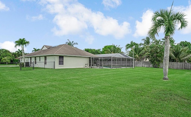 1500 Chapparel Way, Wellington, FL 33414 - fenced backyard with glass enclosure
