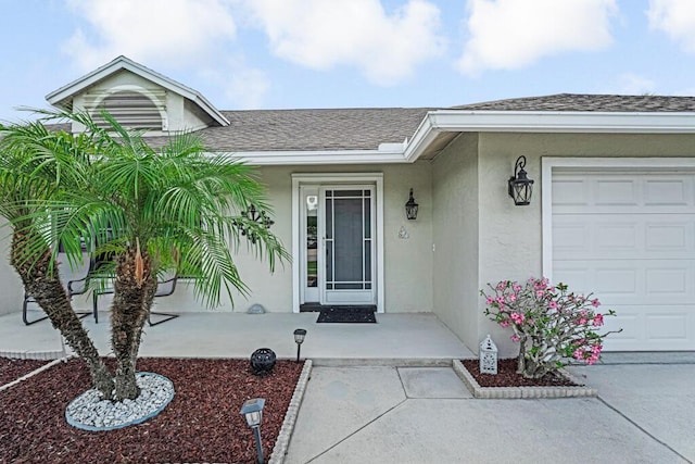 1500 Chapparel Way, Wellington, FL 33414 - view of exterior entry with an attached garage, stucco siding, and roof with shingles