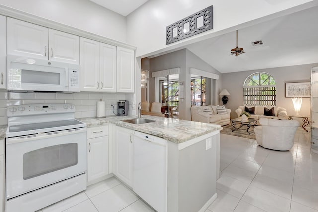 5414 Venetia Ct Unit G, Boynton Beach, FL 33437 - kitchen with white appliances, a sink, a peninsula, white cabinetry, and decorative backsplash