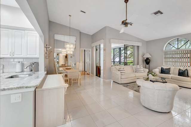 5414 Venetia Ct Unit G, Boynton Beach, FL 33437 - living area featuring plenty of natural light, a chandelier, light tile patterned flooring, high vaulted ceiling, and a ceiling fan