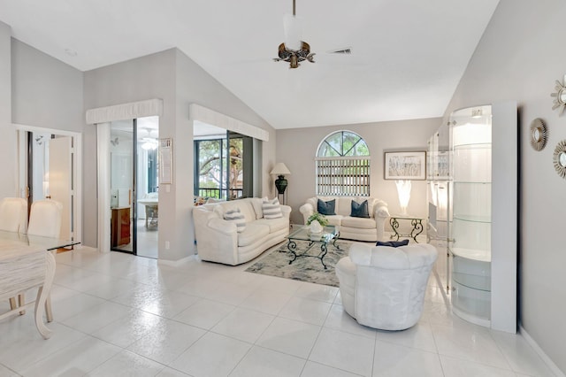 5414 Venetia Ct Unit G, Boynton Beach, FL 33437 - living area featuring a ceiling fan, vaulted ceiling, light tile patterned floors, and baseboards