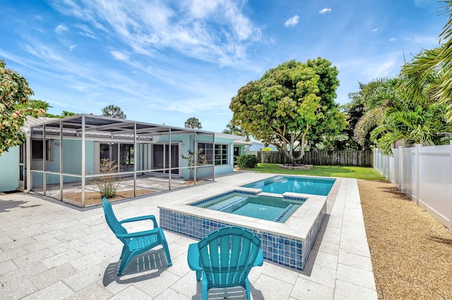 1233 SE 12th Ter, Deerfield Beach, FL 33441 - view of swimming pool with a patio area, a fenced backyard, a pool with connected hot tub, and a lanai