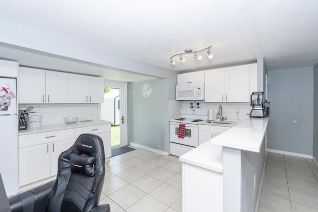 4337 Clinton Blvd, Lake Worth, FL 33461 - kitchen with white appliances, light tile patterned floors, tasteful backsplash, white cabinetry, and light countertops