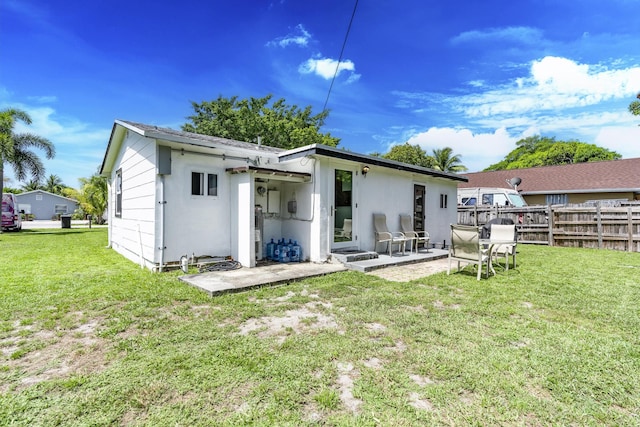 4337 Clinton Blvd, Lake Worth, FL 33461 - back of house featuring a patio area