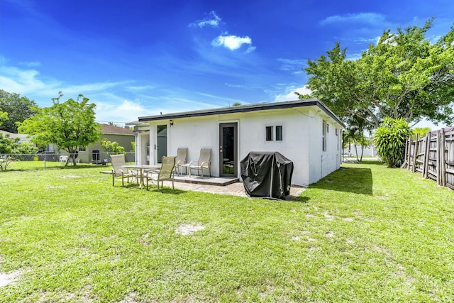 4337 Clinton Blvd, Lake Worth, FL 33461 - rear view of house with a fenced backyard