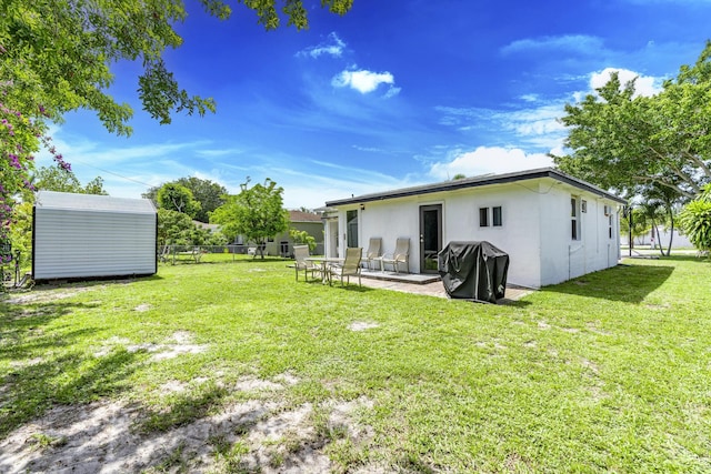 4337 Clinton Blvd, Lake Worth, FL 33461 - view of yard featuring a storage shed and a patio area
