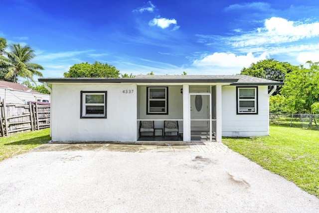 4337 Clinton Blvd, Lake Worth, FL 33461 - bungalow-style home with a porch