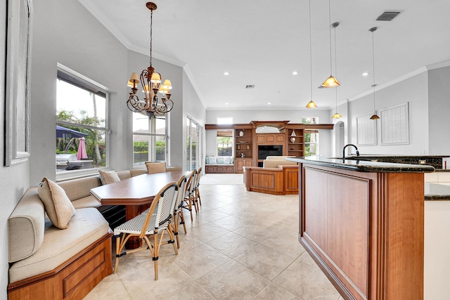 4450 SW Long Bay Dr, Palm City, FL 34990 - dining area with ornamental molding, healthy amount of natural light, a chandelier, recessed lighting, and light tile patterned floors