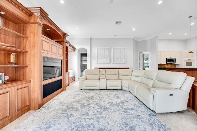 4450 SW Long Bay Dr, Palm City, FL 34990 - living area featuring arched walkways, ornamental molding, and recessed lighting