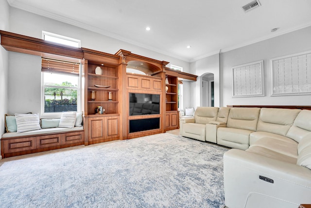4450 SW Long Bay Dr, Palm City, FL 34990 - carpeted living area with crown molding, arched walkways, and recessed lighting