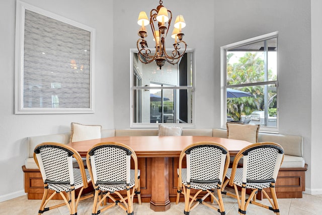 4450 SW Long Bay Dr, Palm City, FL 34990 - tiled dining room with a chandelier and baseboards