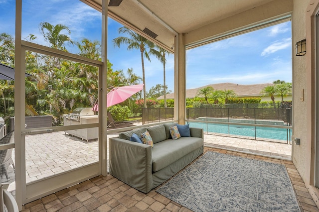 4450 SW Long Bay Dr, Palm City, FL 34990 - sunroom / solarium with area for grilling and an outdoor hangout area