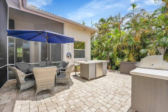 4450 SW Long Bay Dr, Palm City, FL 34990 - view of patio / terrace featuring grilling area, outdoor dining area, and a sink