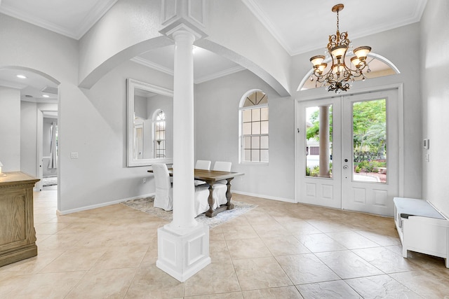 4450 SW Long Bay Dr, Palm City, FL 34990 - entryway with a chandelier, crown molding, arched walkways, and baseboards