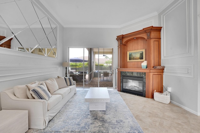 4450 SW Long Bay Dr, Palm City, FL 34990 - living area with a premium fireplace, ornamental molding, and baseboards