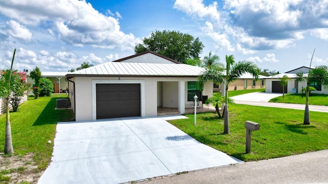 2 Tosca, Fort Pierce, FL 34951 - single story home with stucco siding, central AC unit, a front lawn, concrete driveway, and a garage