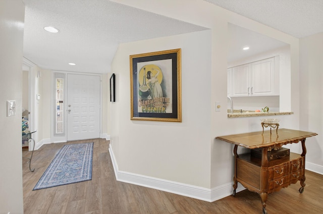 16000 Loch Katrine Trl Unit 8002, Delray Beach, FL 33446 - foyer entrance featuring wood finished floors, recessed lighting, and a textured ceiling