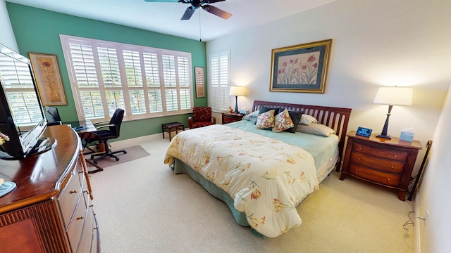 11710 SW Apple Blossom Trl, Port Saint Lucie, FL 34987 - bedroom with light colored carpet, an office area, baseboards, and a ceiling fan