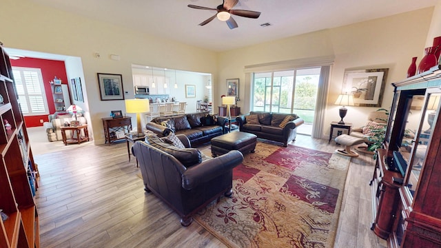 11710 SW Apple Blossom Trl, Port Saint Lucie, FL 34987 - living area with wood finished floors and ceiling fan