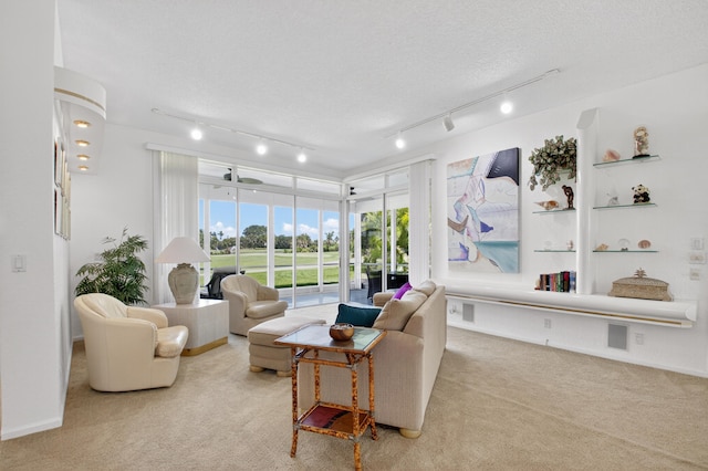 20220 Boca W Dr Unit 1104, Boca Raton, FL 33434 - living area with light carpet, track lighting, and a textured ceiling