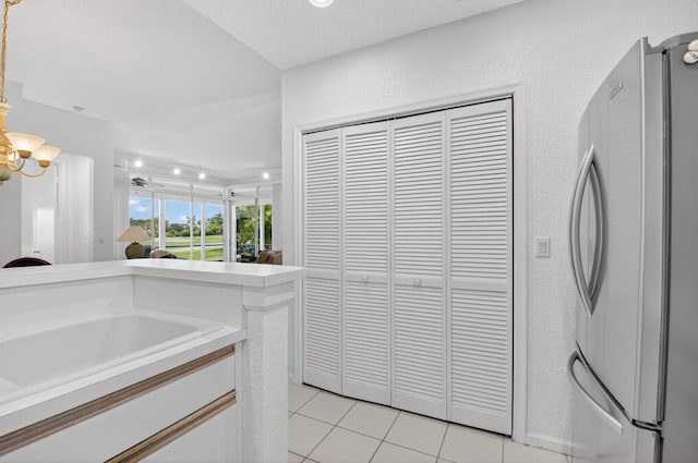 20220 Boca W Dr Unit 1104, Boca Raton, FL 33434 - kitchen featuring appliances with stainless steel finishes, white cabinets, recessed lighting, modern cabinets, and a chandelier